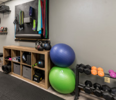 exercise equipment along a wall